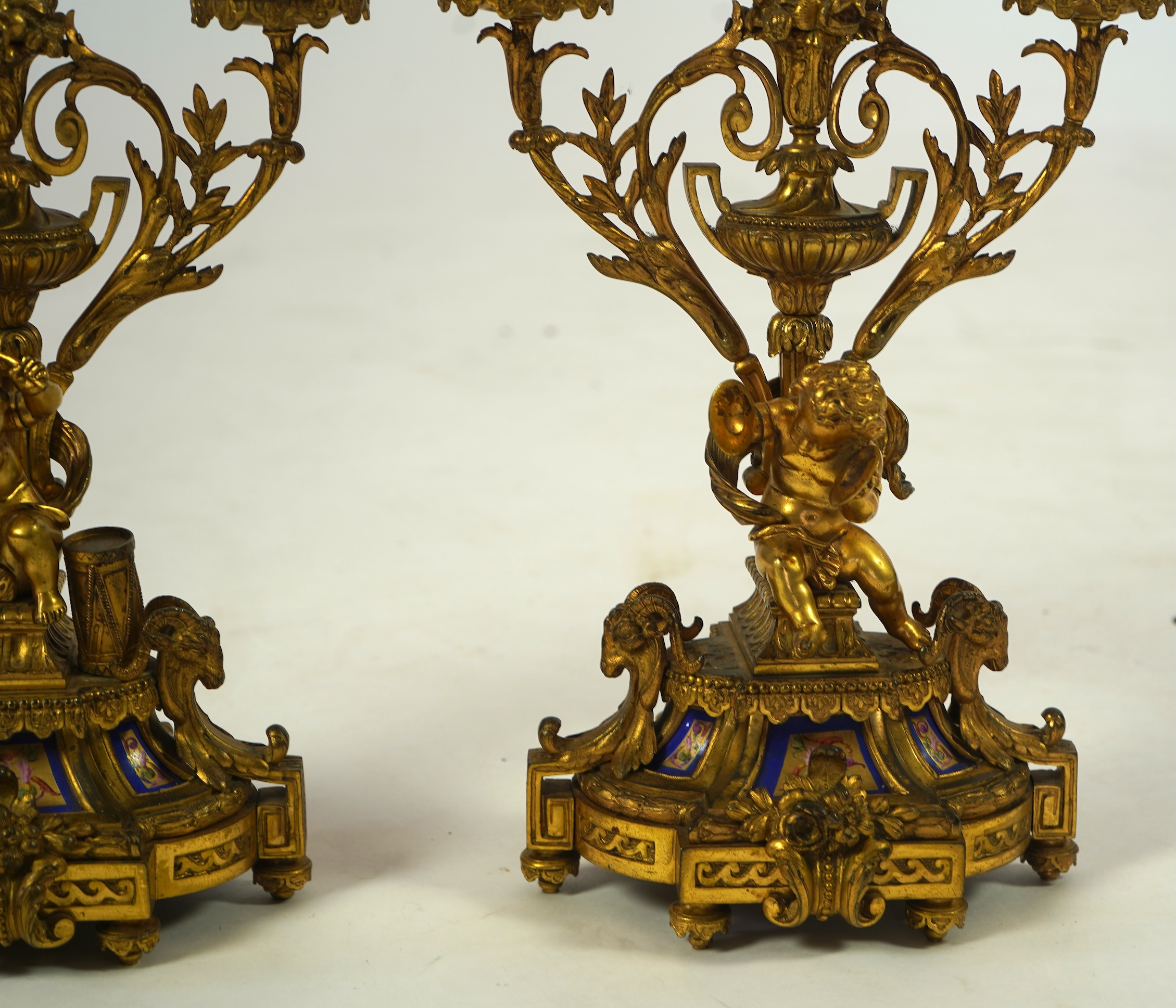 A pair of 19th century French Louis XVI style ormolu three light candelabra